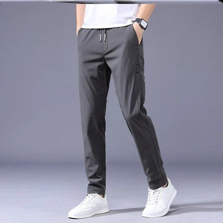 Premium Korean-style drawstring trousers in black, khaki, and dark grey colours, featuring a relaxed, straight-leg silhouette and micro-elastic fabric for comfort and flexibility.