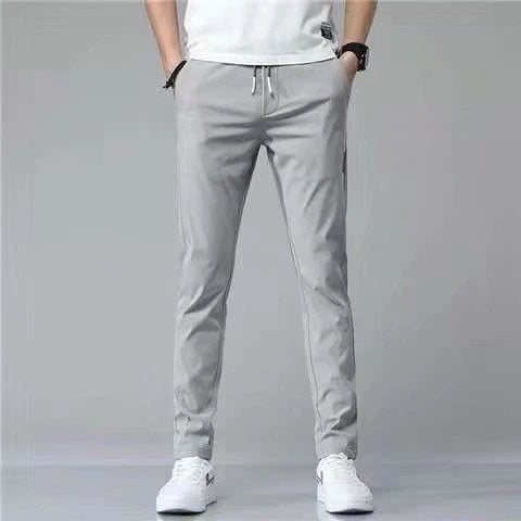 Premium Korean-style drawstring trousers in black, khaki, and dark grey colours, featuring a relaxed, straight-leg silhouette and micro-elastic fabric for comfort and flexibility.