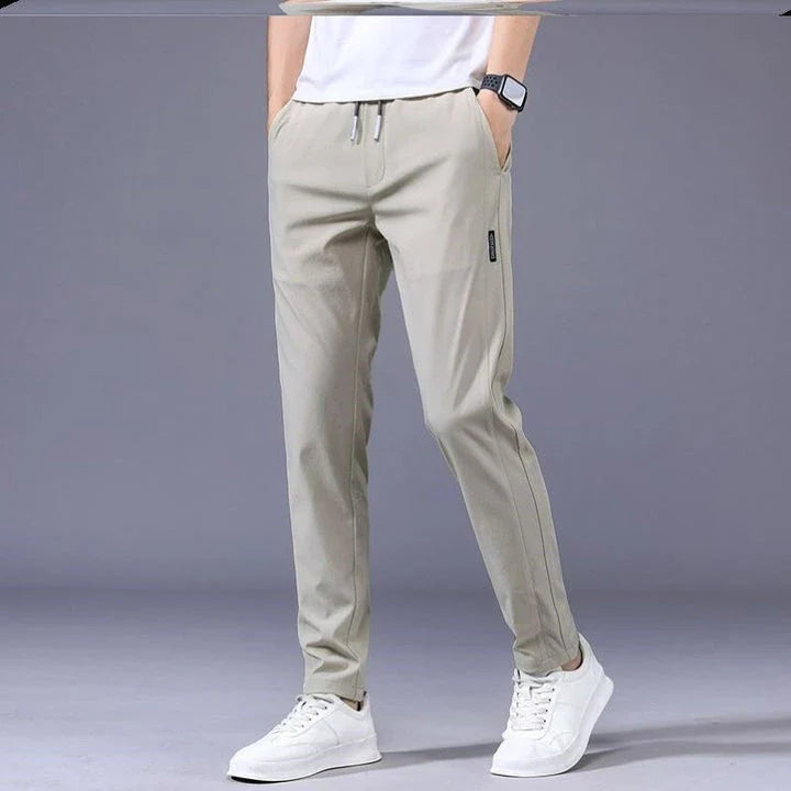 Premium Korean-style drawstring trousers in black, khaki, and dark grey colours, featuring a relaxed, straight-leg silhouette and micro-elastic fabric for comfort and flexibility.