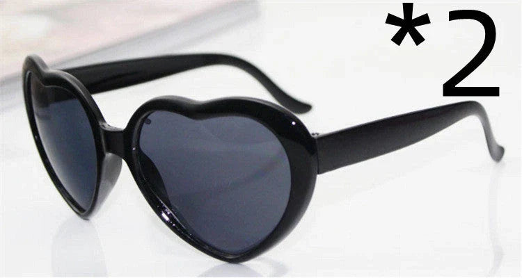 Stylish heart-shaped sunglasses with unique lens design that transforms light into enchanting special effects