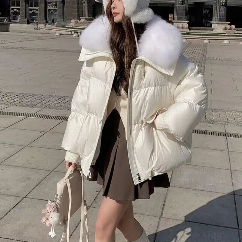Premium down-filled puffer jacket with faux fur collar, available in brown, black, and white colours