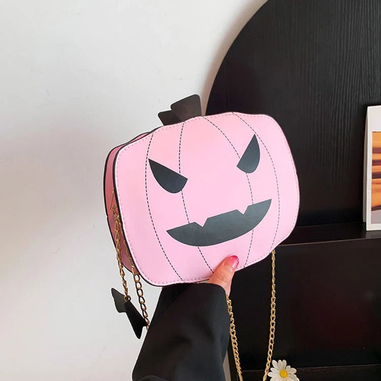 Enchanting Halloween pumpkin-themed shoulder bag in various colours, featuring an adjustable chain strap and trendy urban style