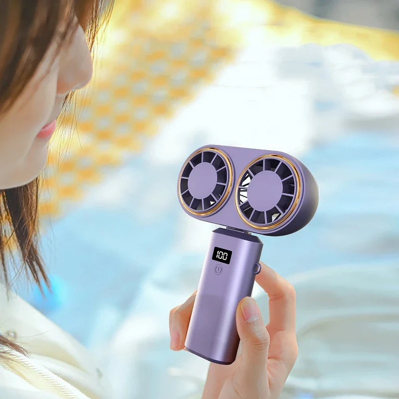 Portable handheld fan with foldable design, digital display, and USB rechargeable power for use in travel, work, and outdoor activities
