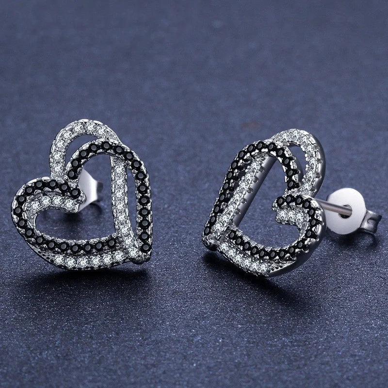 Stylish copper heart-shaped earrings with a double buckle design, perfect for adding a touch of elegance to any outfit.