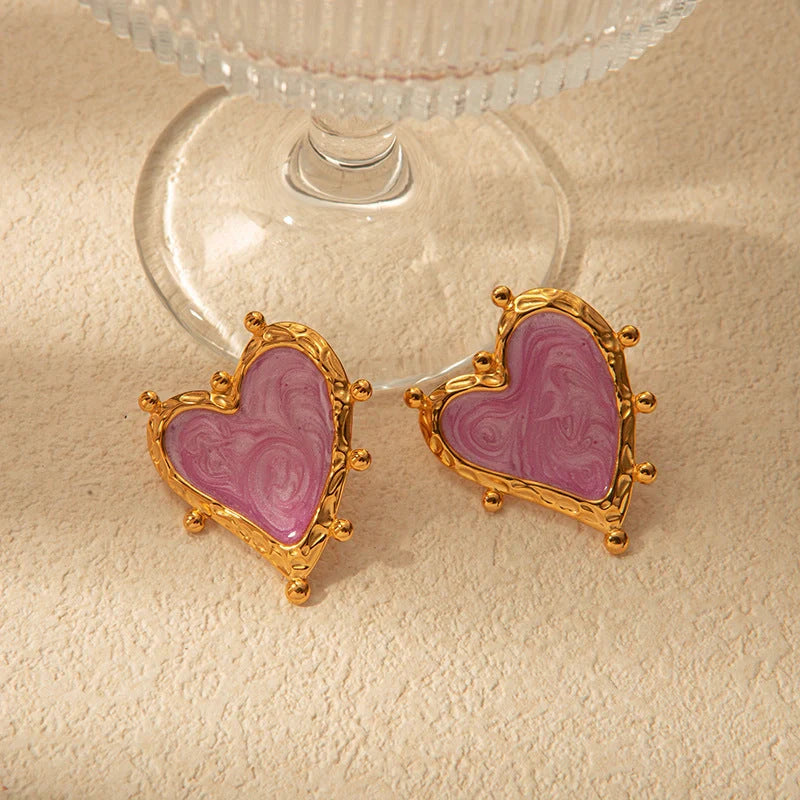 Elegant stainless steel heart-shaped earrings in a range of captivating colours, perfect for adding a touch of romantic flair to any outfit.