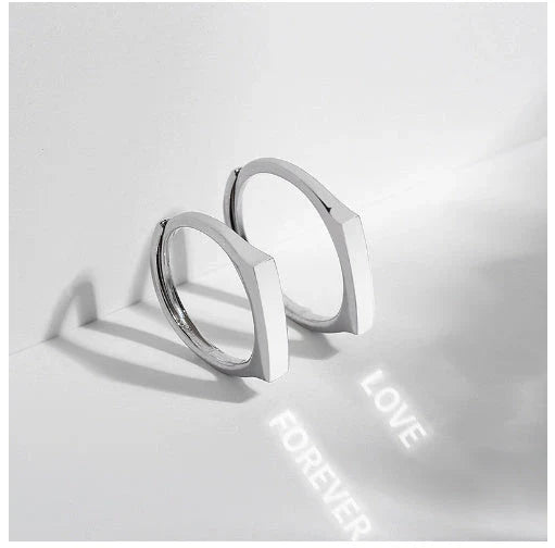 Stylish sterling silver rings with a hidden love pattern design, perfect for romantic gifts or personal accessorizing.