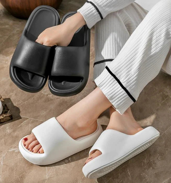 Comfortable EVA foam slip-on slippers in various colors, featuring non-slip soles and a breathable design for indoor and bathroom use.