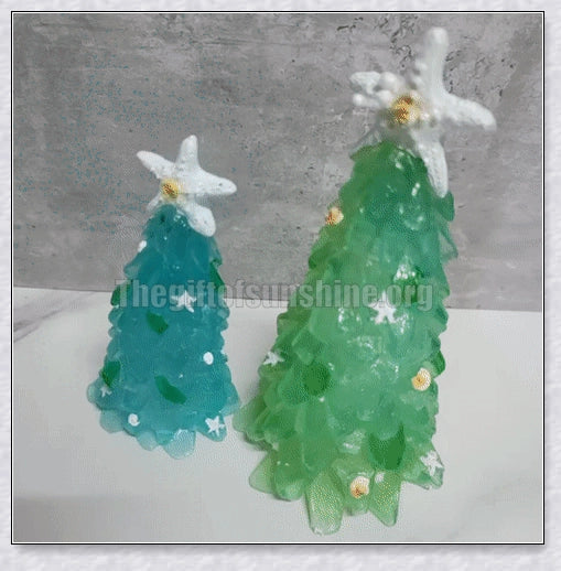 Handcrafted sea glass Christmas tree with blue, green, and turquoise sea glass, seashells, and starfish
