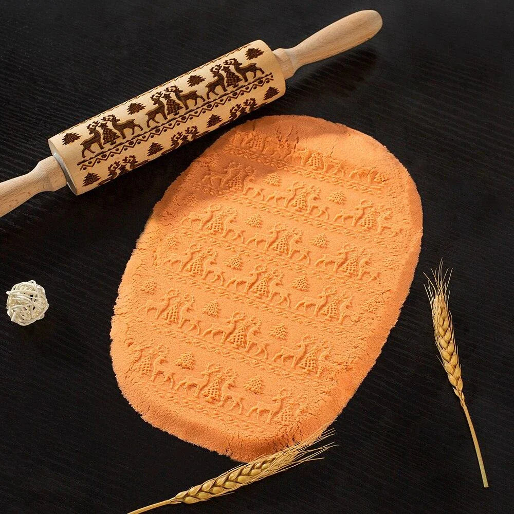 Embossed rolling pin made of natural wood with intricate designs for creating textured baked goods