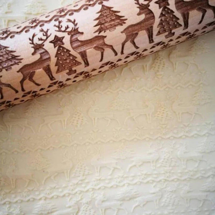 Embossed rolling pin made of natural wood with intricate designs for creating textured baked goods