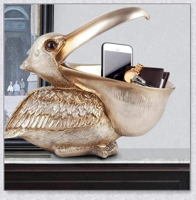 Pelican Storage Figurine, a high-quality resin sculpture with an open mouth design for practical storage and elegant décor.