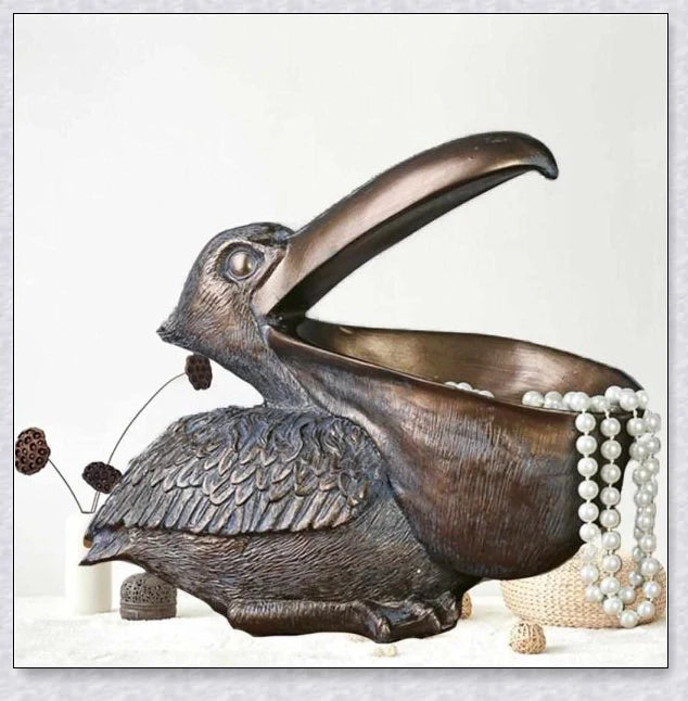 Pelican Storage Figurine, a high-quality resin sculpture with an open mouth design for practical storage and elegant décor.
