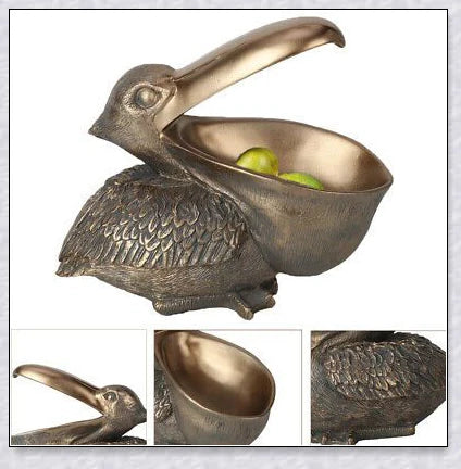 Pelican Storage Figurine, a high-quality resin sculpture with an open mouth design for practical storage and elegant décor.
