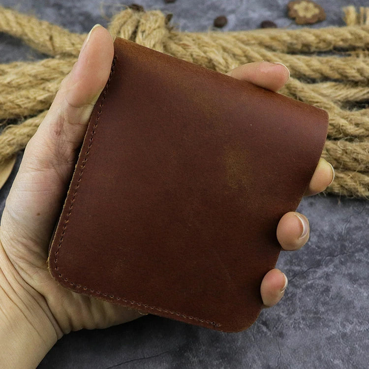 A close-up view of a premium leather wallet in a light brown colour, featuring a single money clip and multiple card slots for organised storage of essentials.