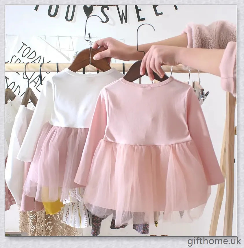 Soft, premium cotton baby girl dress with charming bow detail and cosy corduroy fabric