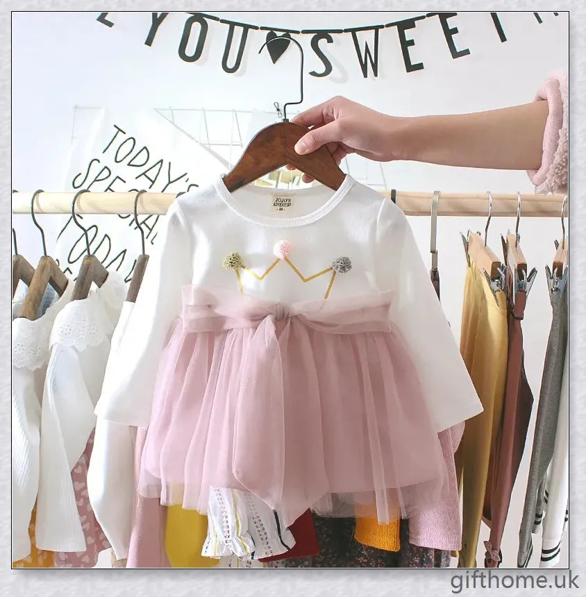 Soft, premium cotton baby girl dress with charming bow detail and cosy corduroy fabric