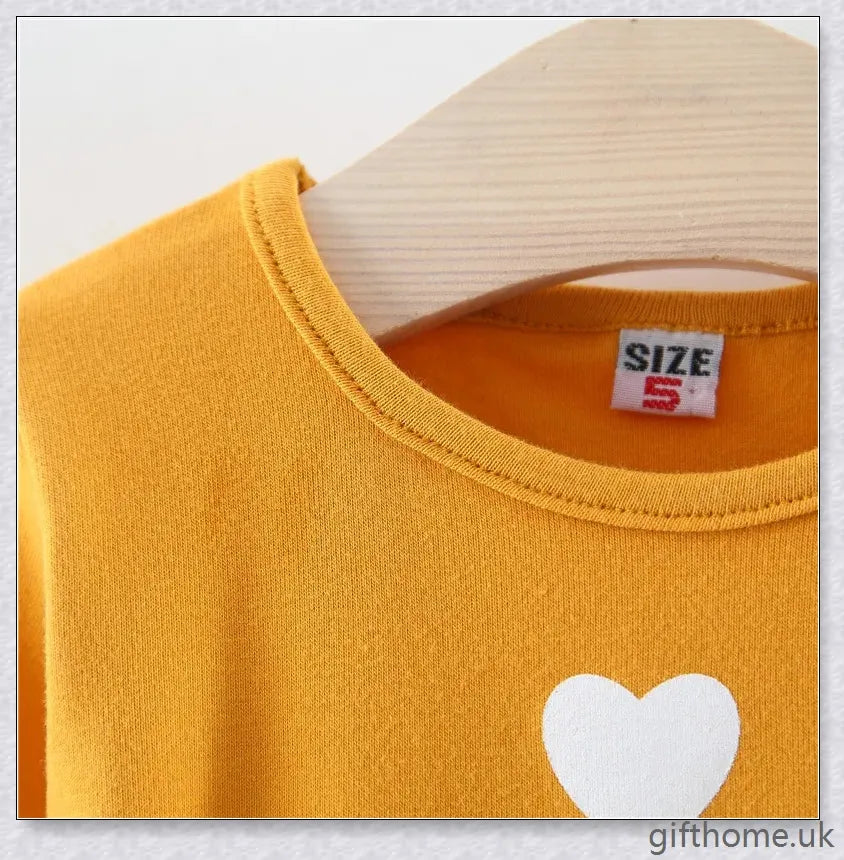 Soft, premium cotton baby girl dress with charming bow detail and cosy corduroy fabric