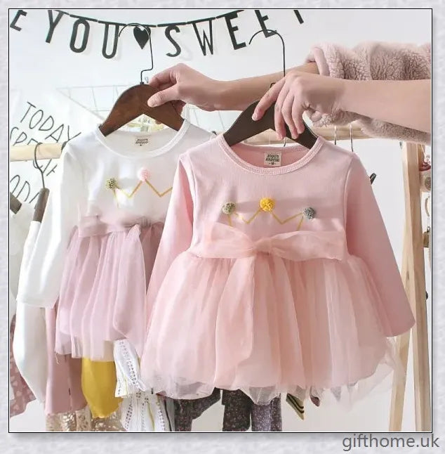 Soft, premium cotton baby girl dress with charming bow detail and cosy corduroy fabric