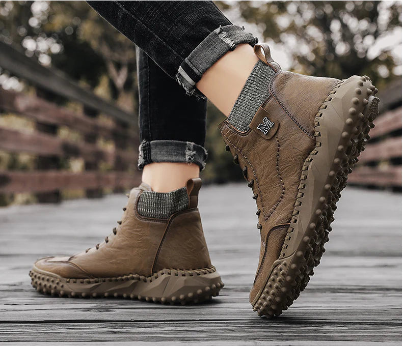 Stylish high-top leather boots in black, grey, and brown colours with a comfortable, breathable design