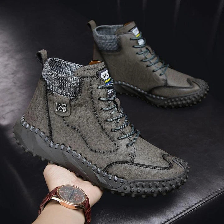 Stylish high-top leather boots in black, grey, and brown colours with a comfortable, breathable design