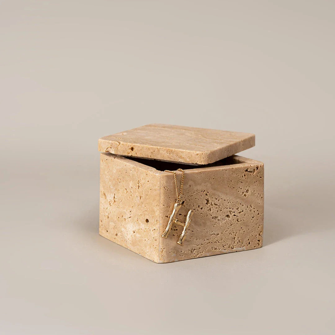 Beige natural travertine stone storage box with lid, featuring a sleek, square design and Scandinavian-inspired aesthetic