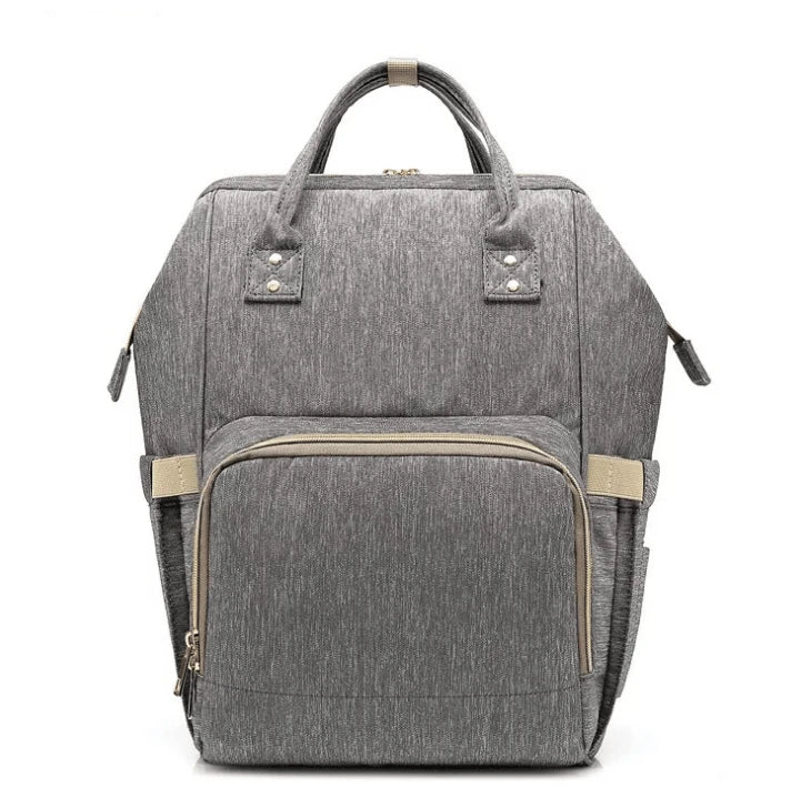 Multi-purpose large capacity mummy bag in blue, with a sleek backpack-inspired design and ample storage for parenting essentials