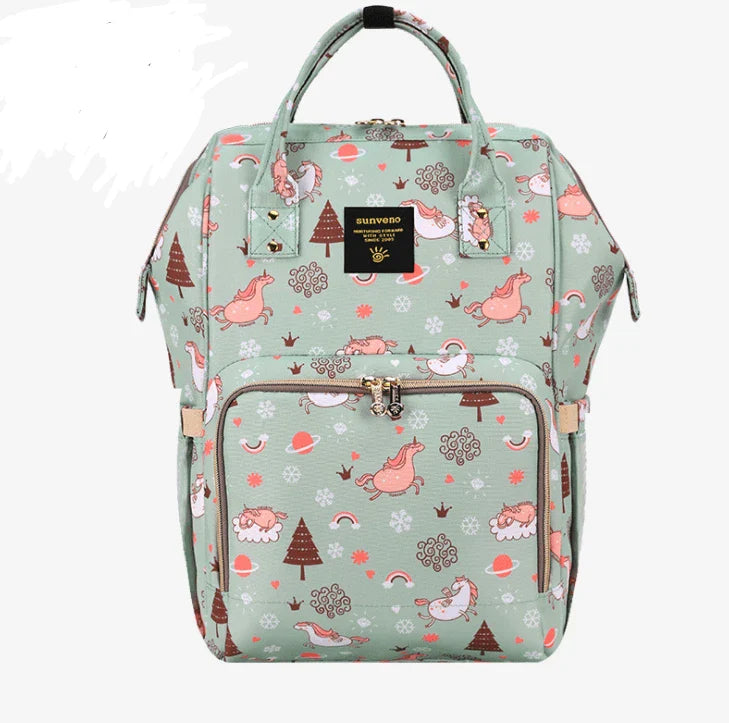 Multi-purpose large capacity mummy bag in blue, with a sleek backpack-inspired design and ample storage for parenting essentials