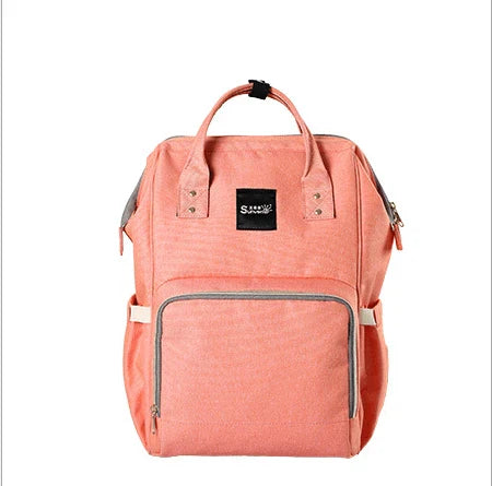 Multi-purpose large capacity mummy bag in blue, with a sleek backpack-inspired design and ample storage for parenting essentials