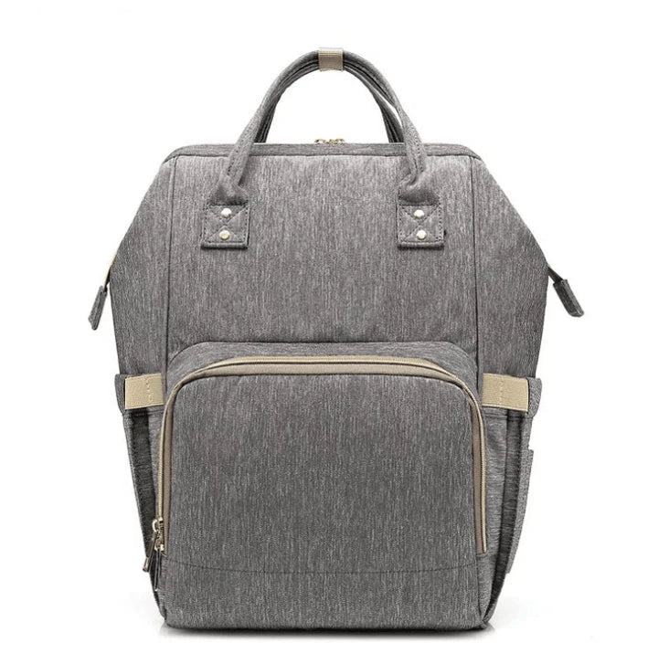 Multi-purpose large capacity mummy bag in blue, with a sleek backpack-inspired design and ample storage for parenting essentials