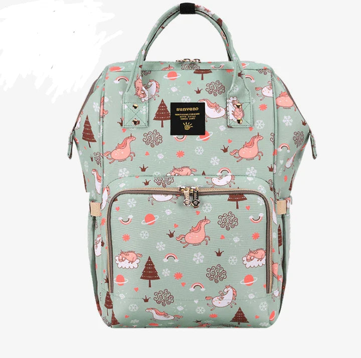 Multi-purpose large capacity mummy bag in blue, with a sleek backpack-inspired design and ample storage for parenting essentials