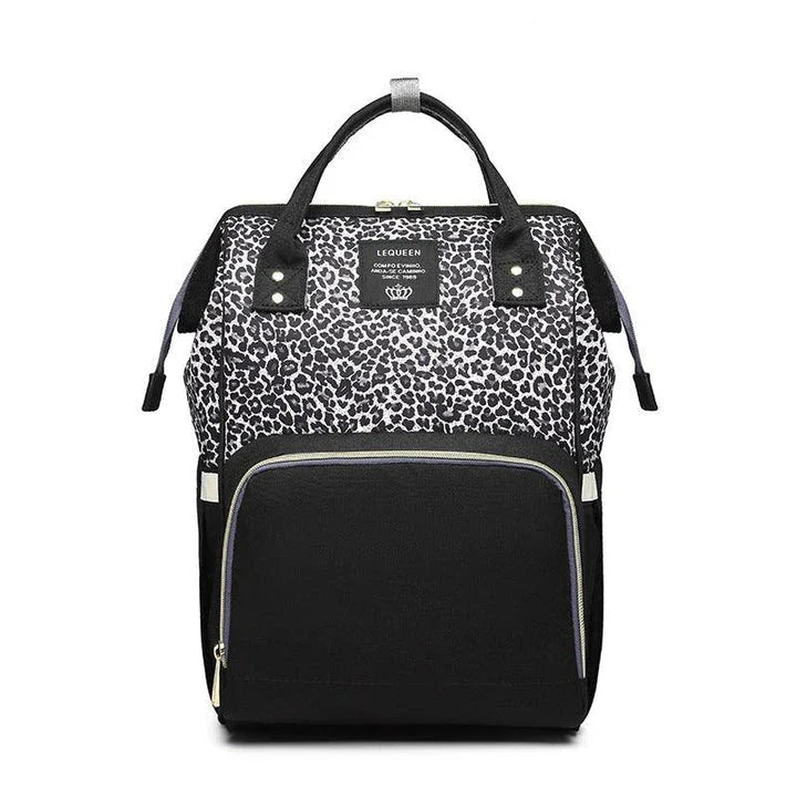 Multi-purpose large capacity mummy bag in blue, with a sleek backpack-inspired design and ample storage for parenting essentials