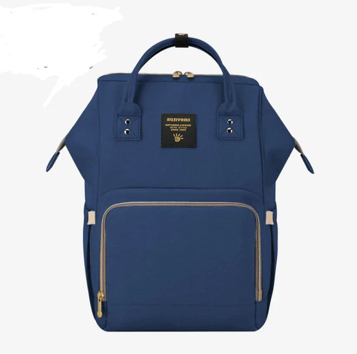 Multi-purpose large capacity mummy bag in blue, with a sleek backpack-inspired design and ample storage for parenting essentials