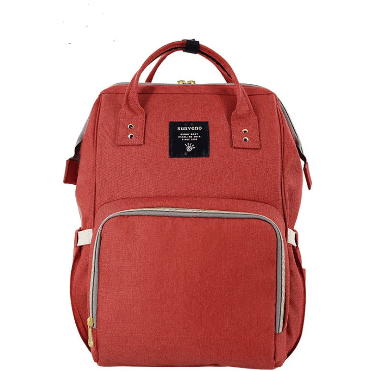 Multi-purpose large capacity mummy bag in blue, with a sleek backpack-inspired design and ample storage for parenting essentials