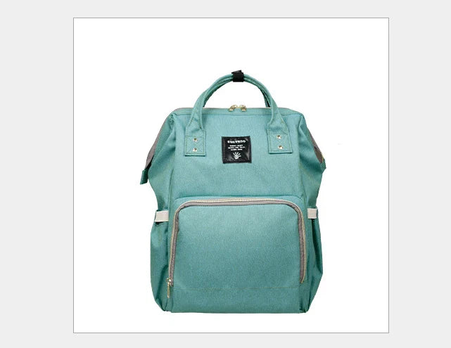 Multi-purpose large capacity mummy bag in blue, with a sleek backpack-inspired design and ample storage for parenting essentials