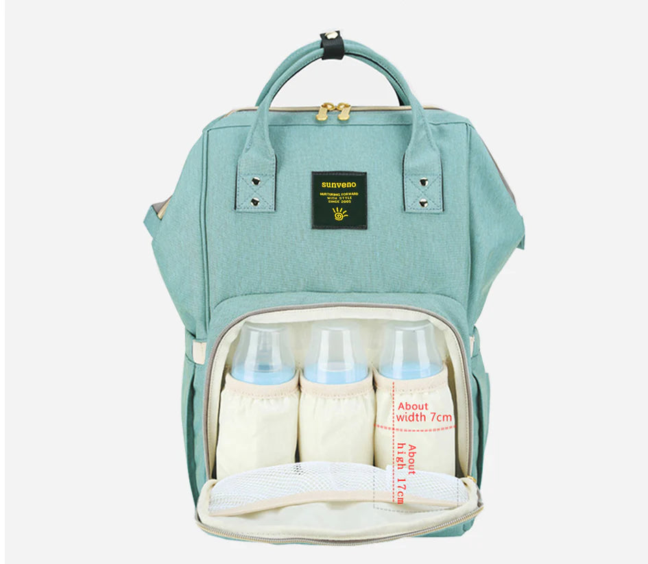 Multi-purpose large capacity mummy bag in blue, with a sleek backpack-inspired design and ample storage for parenting essentials