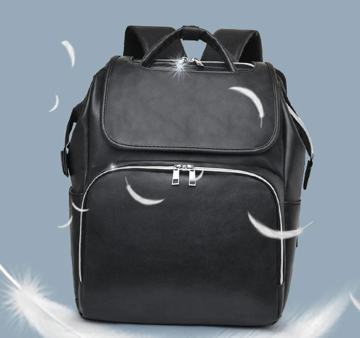 PU Leather Diaper Bag Backpack in Black, featuring side pocket, anti-theft compartment, and stroller straps