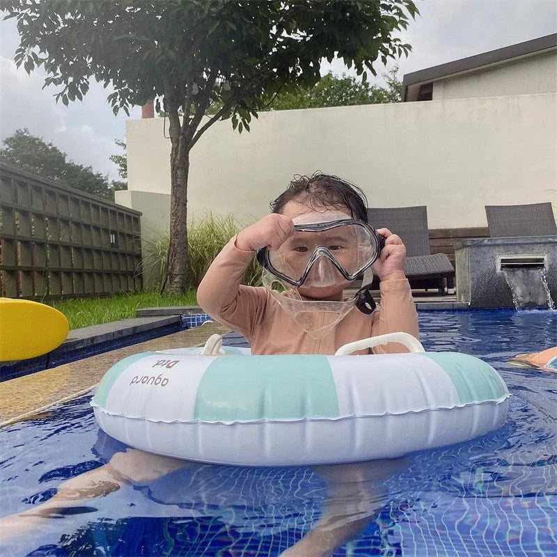A green inflatable swim ring with a cotton pocket seat, designed for safe and enjoyable water play for children aged 1-5 years.