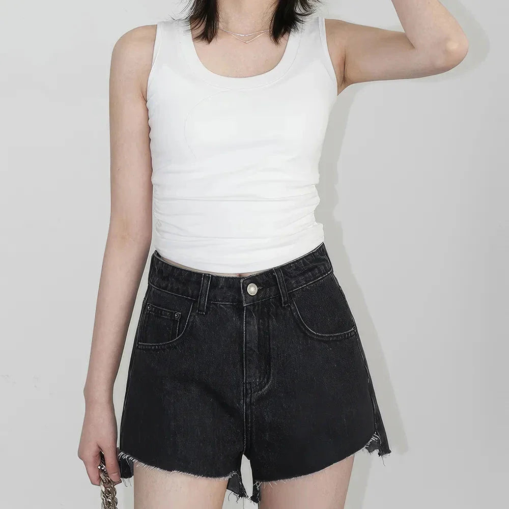 Women's high-waisted denim shorts with asymmetric hemline in black colour