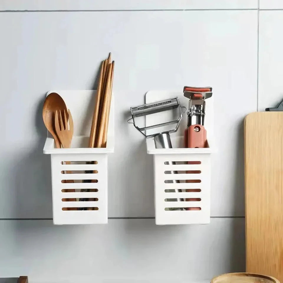 A white, wall-mounted toothbrush and cosmetic holder with a suction cup for easy installation