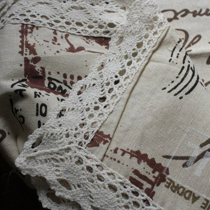 A decorative Paris-themed cotton and linen tablecloth featuring iconic landmarks and a romantic French design