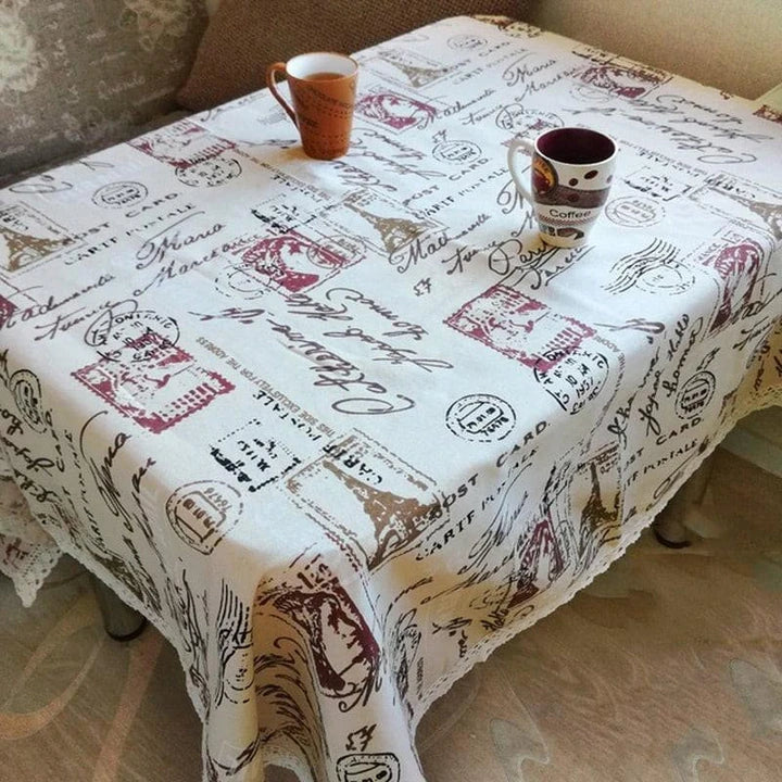 A decorative Paris-themed cotton and linen tablecloth featuring iconic landmarks and a romantic French design