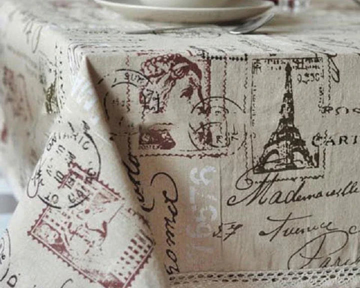 A decorative Paris-themed cotton and linen tablecloth featuring iconic landmarks and a romantic French design