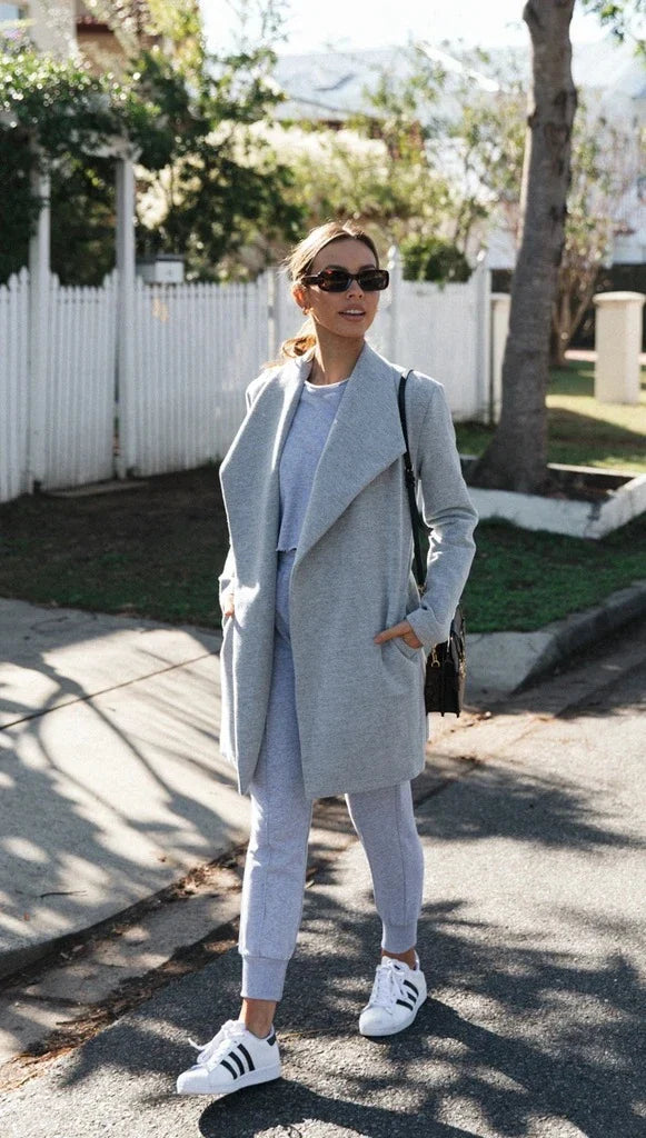 Premium polyester fibre trench coat in solid grey or black colour, with a timeless silhouette and flattering fit