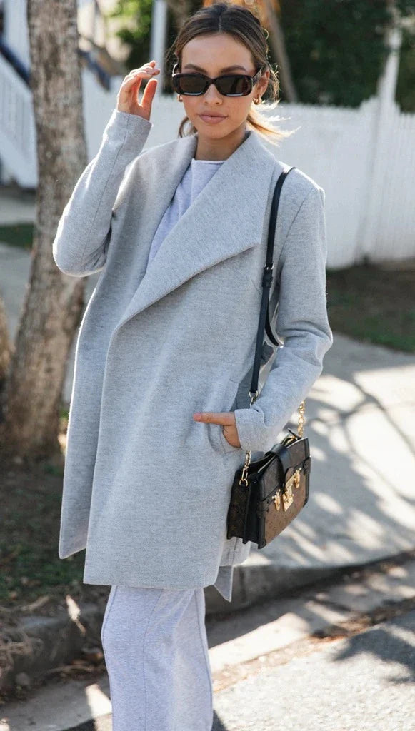 Premium polyester fibre trench coat in solid grey or black colour, with a timeless silhouette and flattering fit