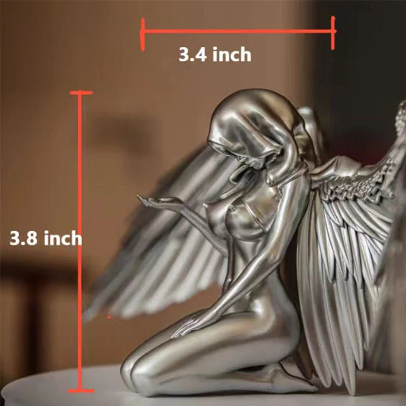 Elegant silver angel wings resin ornament with intricate feather detailing and a warm, ambient glow