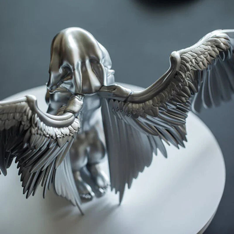 Elegant silver angel wings resin ornament with intricate feather detailing and a warm, ambient glow