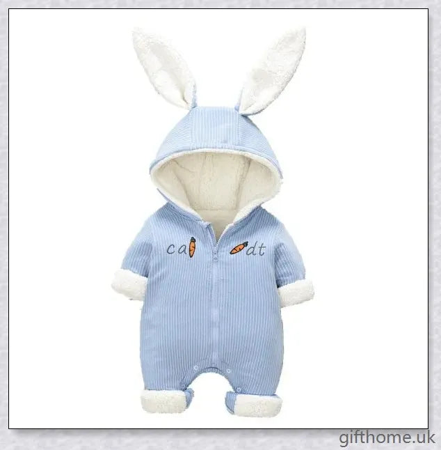 Adorable baby wearing a cosy, hooded rabbit-themed jumpsuit in light blue