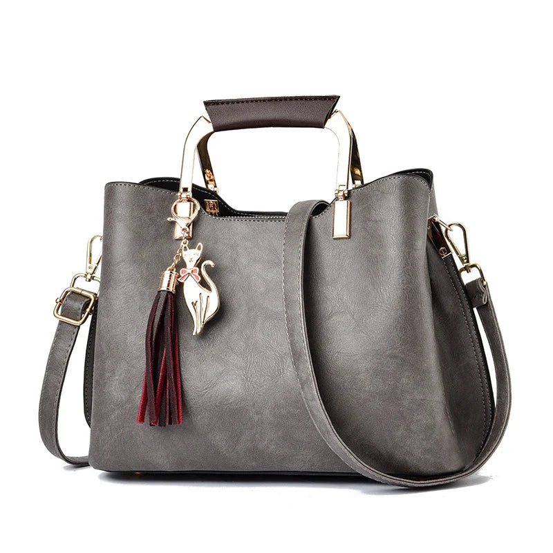 Stylish and versatile ladies handbag in black, featuring a horizontal square design with multiple interior compartments for optimal organisation.
