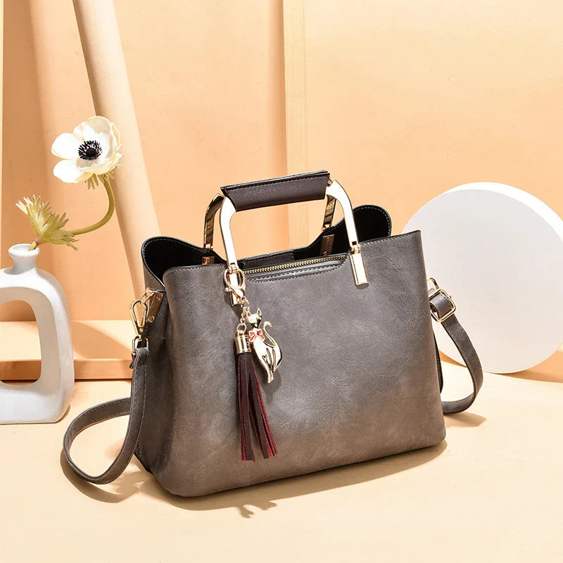 Stylish and versatile ladies handbag in black, featuring a horizontal square design with multiple interior compartments for optimal organisation.