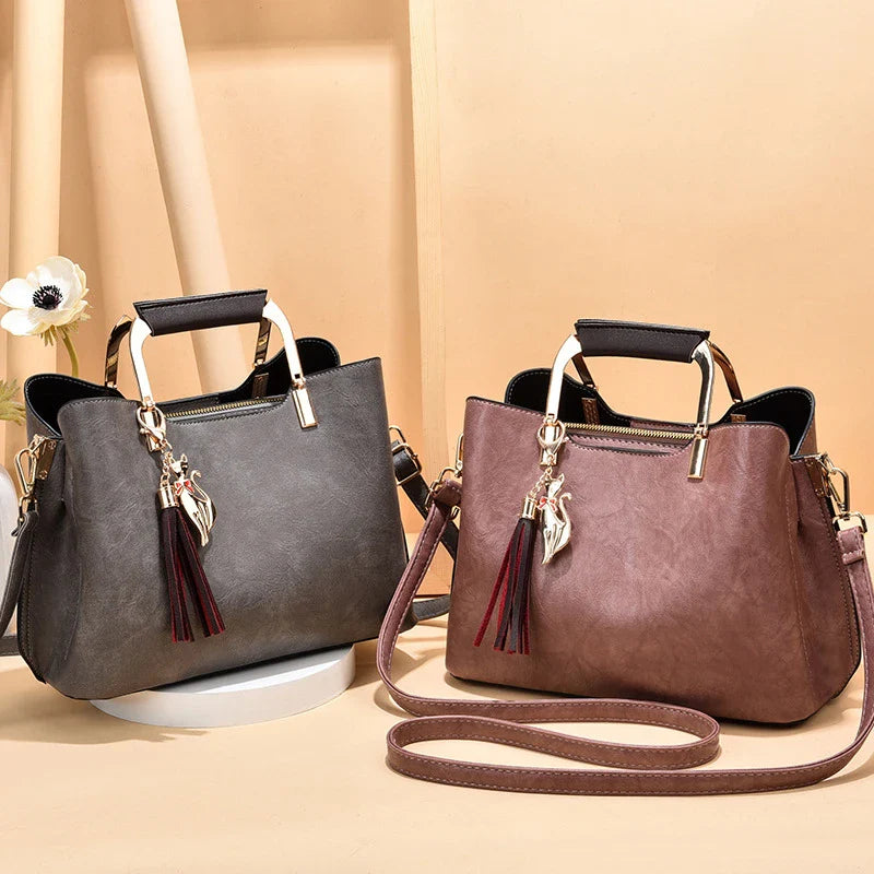 Stylish and versatile ladies handbag in black, featuring a horizontal square design with multiple interior compartments for optimal organisation.